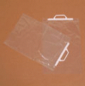 Clear poly bags with a rigid handle