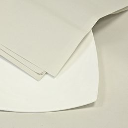 sheets of white news offcut paper